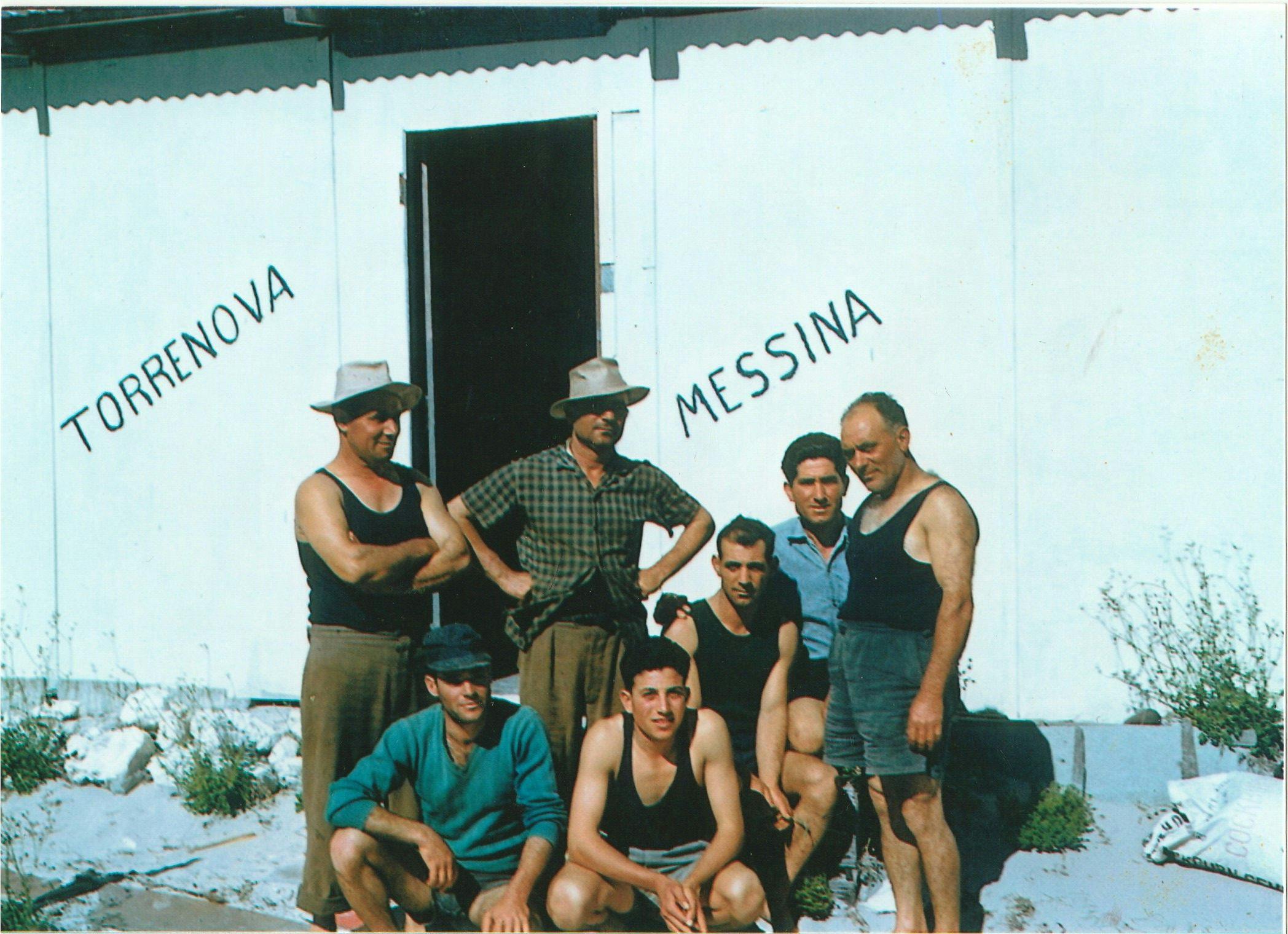 A photo of the fishing crew outside their shed at Ledge Point